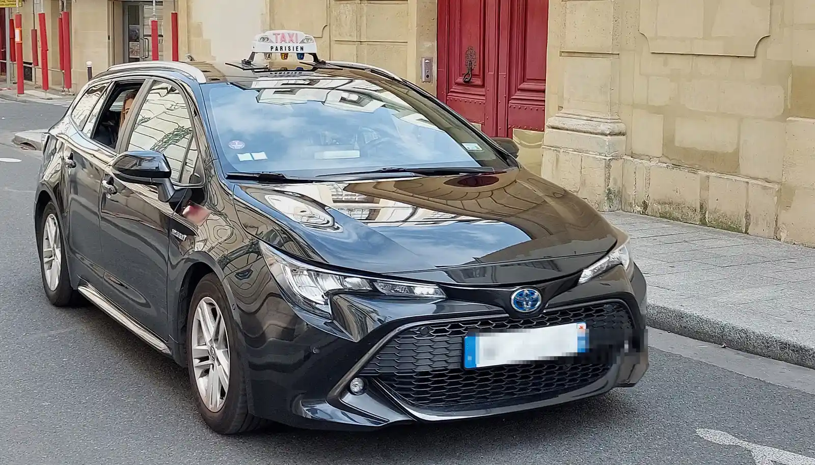 Paris taxi Toyota Corolla, three-quarter front view